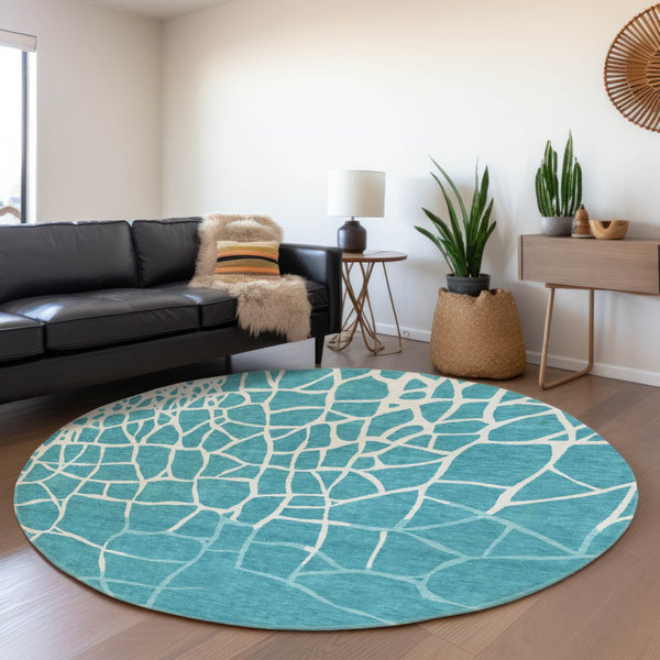 HomeRoots 8' Teal and Ivory Abstract Geometric Round Rug - Washable, UV Protected, Perfect for Active Homes! 682316