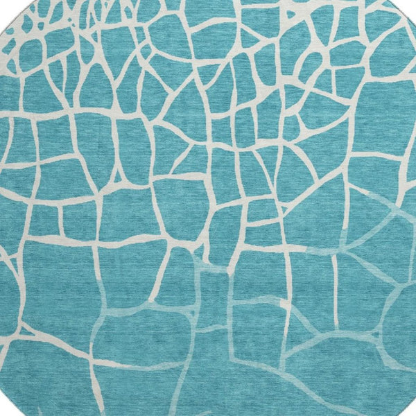 HomeRoots 8' Teal and Ivory Abstract Geometric Round Rug - Washable, UV Protected, Perfect for Active Homes! 682316