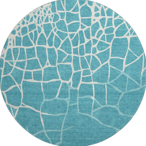 HomeRoots 8' Teal and Ivory Abstract Geometric Round Rug - Washable, UV Protected, Perfect for Active Homes! 682316
