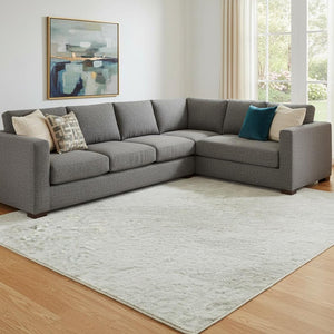 HomeRoots 10' X 14' Ivory and Beige Abstract Area Rug - Washable, UV-Protected, Soft, Durable for Modern Spaces 682373