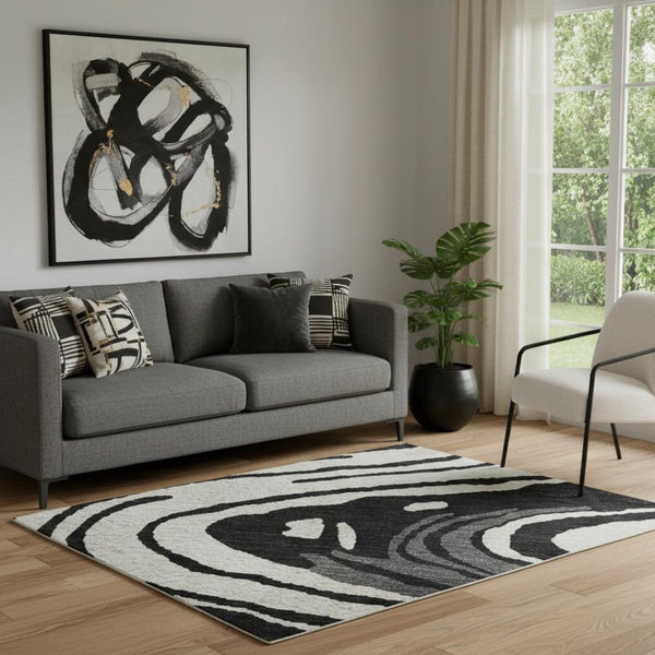 HomeRoots 5' X 8' Contemporary Black Ivory Gray Abstract Area Rug - Washable, UV-Protected, Durable Design 682399