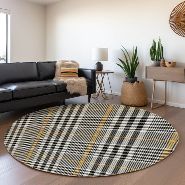 HomeRoots 8' Black Ivory and Gold Plaid Round Rug - Washable, UV Protected, Durable for High-Traffic Areas 682604