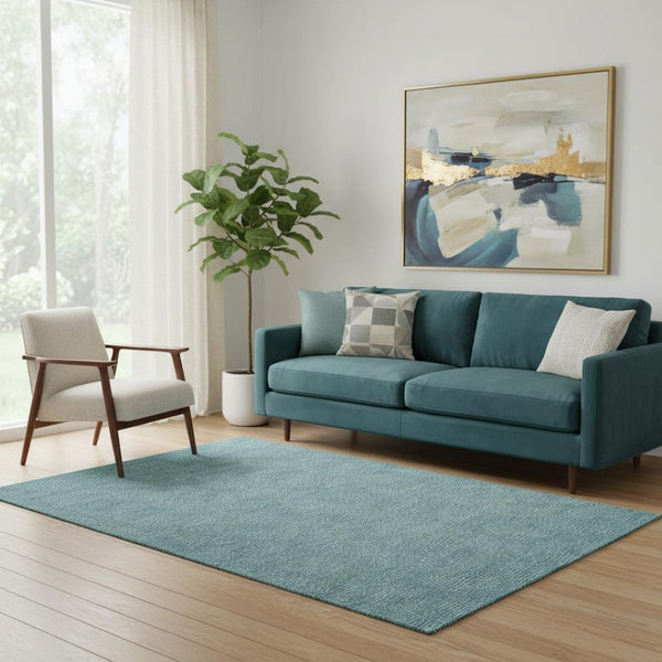 HomeRoots 5' X 8' Stylish Teal and Ivory Geometric Area Rug - Washable, UV-Protected, Perfect for Homes! 682879