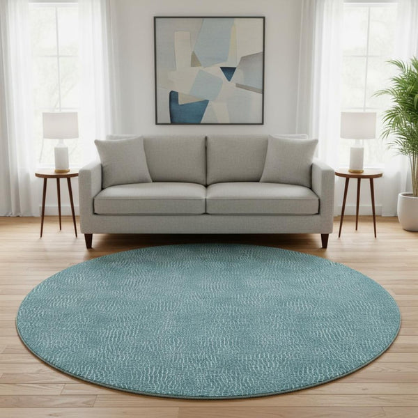 HomeRoots 8' Teal And Ivory Geometric Round Rug - Washable, UV-Protected, Durable for High-Traffic Areas 682880
