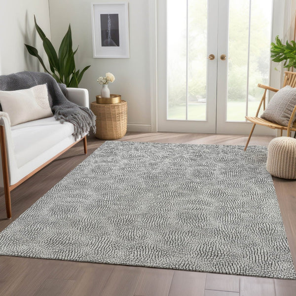 HomeRoots 5' X 8' Modern White and Black Geometric Area Rug with Stain Resistance and UV Protection Benefits 682939