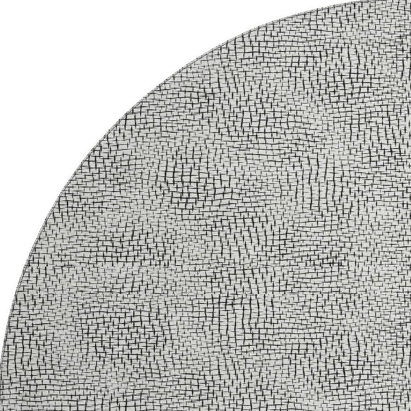 HomeRoots 8' Modern Black and White Geometric Washable Round Rug with UV Protection for High-Traffic Rooms 682940