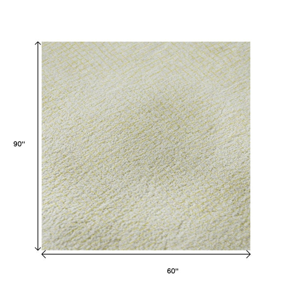 HomeRoots 5' X 8' Yellow and Ivory Geometric Area Rug – Stylish, Washable, UV-Protected for High-Traffic Spaces 682945