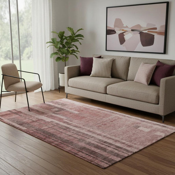 HomeRoots 5' X 8' Washable Rust and Coral Striped Area Rug with UV Protection for Stylish, Durable Spaces 683281