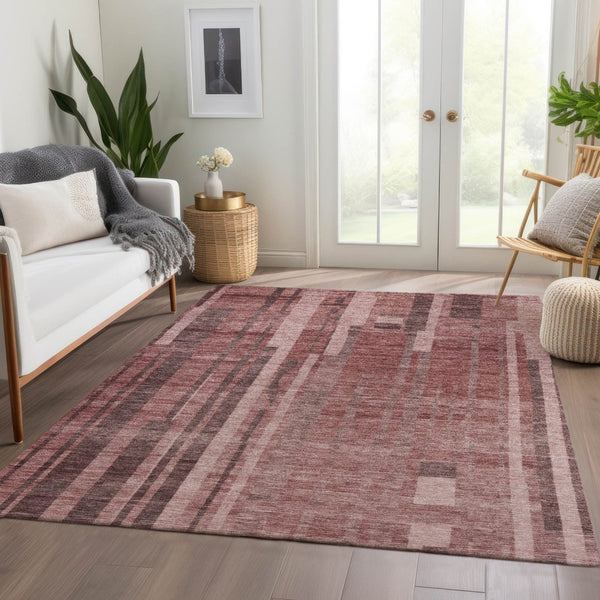 HomeRoots 5' X 8' Washable Rust and Coral Striped Area Rug with UV Protection for Stylish, Durable Spaces 683281