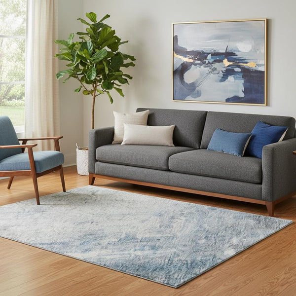 HomeRoots 5' X 8' Washable Abstract Area Rug in Blue, Ivory & Gray with UV Protection for Modern Spaces 684168