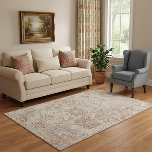 HomeRoots 5' X 8' Coral Ivory and Rust Damask Rug - Soft, Washable, UV-Protected for Elegant Living Spaces 684312