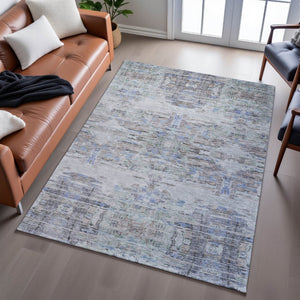 HomeRoots 9' X 12' Taupe Blue Gray Abstract Area Rug - Stain Resistant, UV Protected, Stylish for High-Traffic Rooms 684665