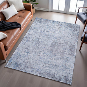 HomeRoots 9' X 12' Sky Blue Gray Silver Abstract Area Rug - Durable, Washable, UV-Protected for Family Spaces 685396