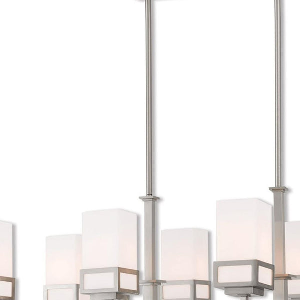 HomeRoots Eight Light Dimmable Chandelier with Sleek Cylinder Shades for Modern Ambiance in Any Space 687149