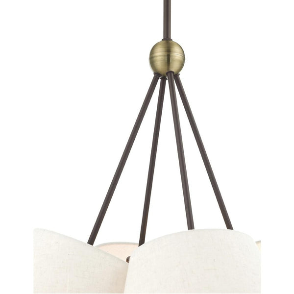 HomeRoots Four Light Dimmable Chandelier with Elegant Cylinder Shades for Modern Home Ambiance and Style 687320