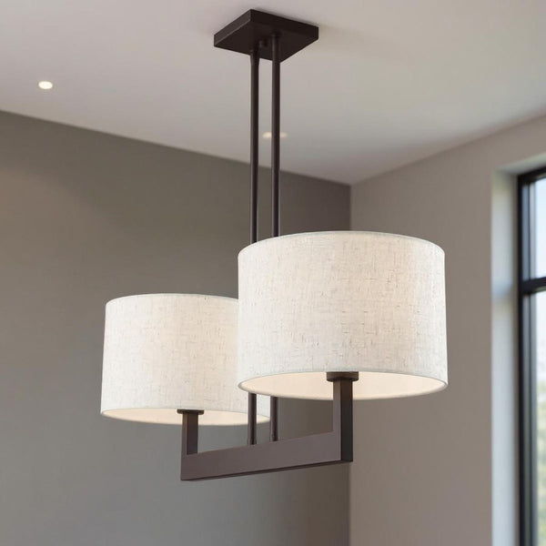 HomeRoots Bronze Two-Light Dimmable Chandelier with Unique Cylinder Shades for Elegant Home Illumination 687341
