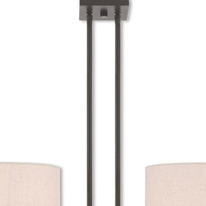HomeRoots Bronze Two-Light Dimmable Chandelier with Unique Cylinder Shades for Elegant Home Illumination 687341