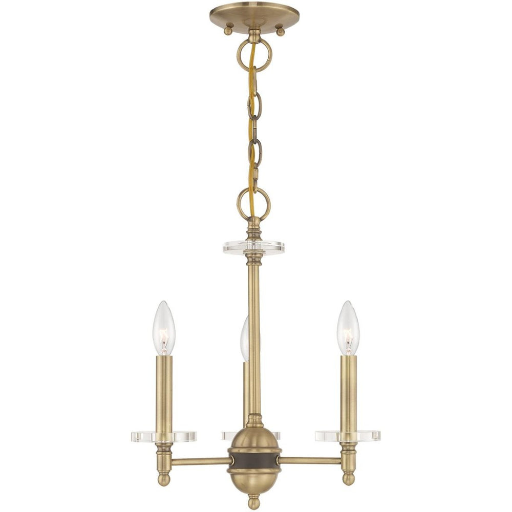 HomeRoots Antiqued Brass Three-Light Chandelier with Clear Shades – Vintage Elegance for Modern Spaces 687377