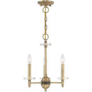 HomeRoots Antiqued Brass Three-Light Chandelier with Clear Shades – Vintage Elegance for Modern Spaces 687377