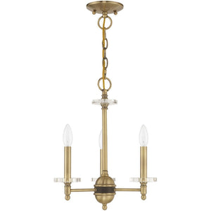 HomeRoots Antiqued Brass Three-Light Chandelier with Clear Shades – Vintage Elegance for Modern Spaces 687377