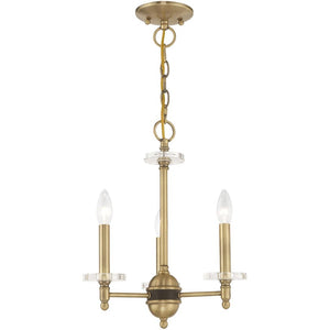 HomeRoots Antiqued Brass Three-Light Chandelier with Clear Shades – Vintage Elegance for Modern Spaces 687377
