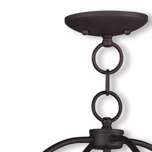 HomeRoots Bronze Four-Light Dimmable Chandelier with Cylinder Shades - Elegant Steel Fixture for Any Room 687450