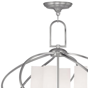HomeRoots Four Light Dimmable Chandelier with Sleek Cylinder Shades for Modern Home Ambiance & Style 687496