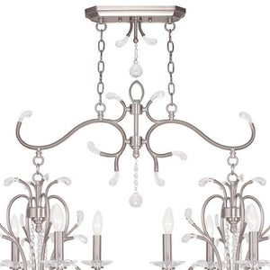 HomeRoots Nickel Eight-Light Dimmable Chandelier – Modern Cylinder Design in Nickel & Clear Finish for Any Room 687646
