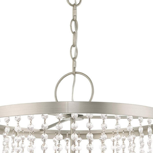 HomeRoots Four Light Dimmable Chandelier with Stylish Cylindrical Shades for Modern Ambiance & Versatility 687653