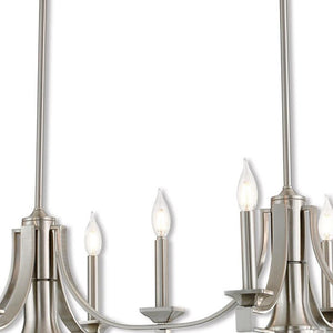 HomeRoots Nickel Nine-Light Dimmable Chandelier with Unique Cylinder Shades for Elegant Home Ambiance 687900