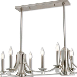 HomeRoots Nickel Nine-Light Dimmable Chandelier with Unique Cylinder Shades for Elegant Home Ambiance 687900