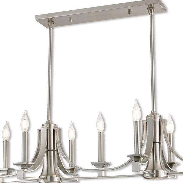 HomeRoots Nickel Nine-Light Dimmable Chandelier with Unique Cylinder Shades for Elegant Home Ambiance 687900