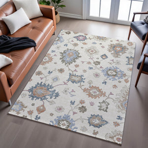 HomeRoots 8' X 10' Elegant Floral Area Rug in Ivory, Blue & Coral - Stain Resistant, UV Protected & Washable 688490