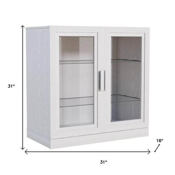 HomeRoots 31" White Wood Accent Cabinet - Stylish Glass Doors & Versatile Storage for Modern Living Spaces 691105
