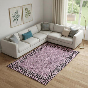 HomeRoots 10' X 14' Pink and Black Animal Print Washable Area Rug with UV Protection for Stylish Spaces 692052