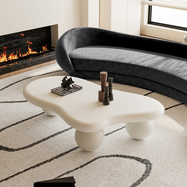 English Elm 47 Inch Cloud-Shaped Coffee Table With Elegant Cream Finish & 3 Ball Legs For Modern Living Spaces W1435S00014