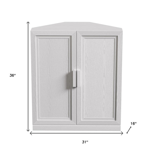 HomeRoots 31" White Wood Corner Accent Cabinet - Stylish Storage Solution for Small Spaces & Modern Decor! 693406