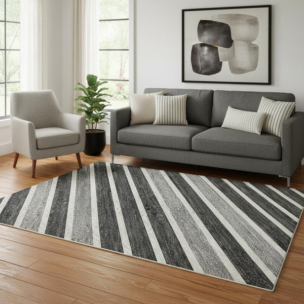 HomeRoots 5' X 8' Stylish Black, Gray & Silver Striped Washable Area Rug with UV Protection for Busy Homes 693452