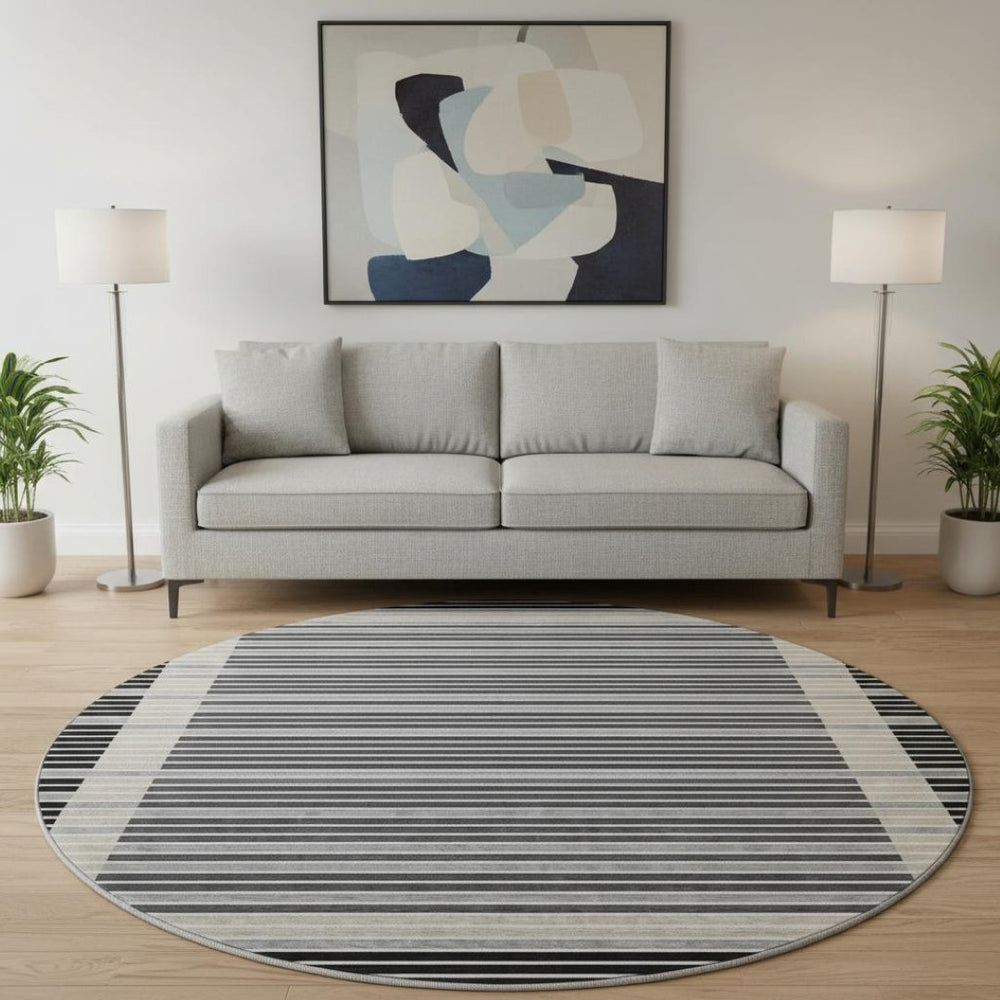 HomeRoots 8' X 8' Stylish Black, Gray, and Silver Striped Washable Round Rug with UV Protection for Durability 693453