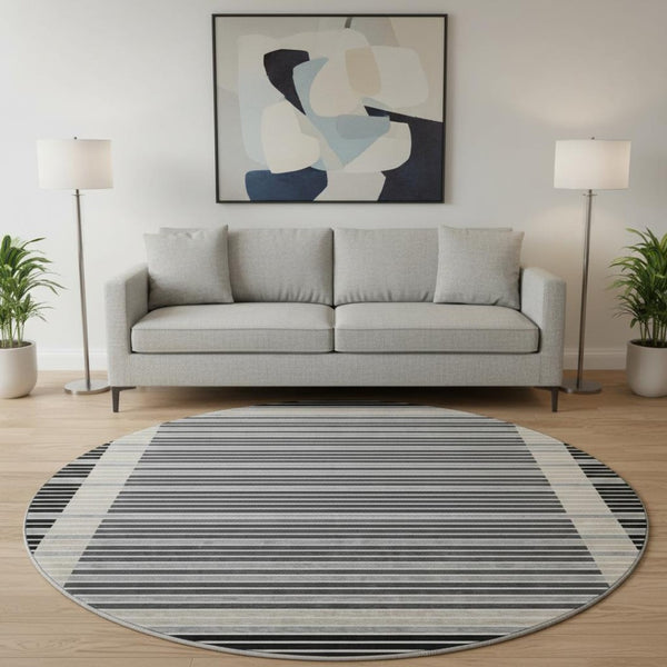 HomeRoots 8' X 8' Stylish Black, Gray, and Silver Striped Washable Round Rug with UV Protection for Durability 693453