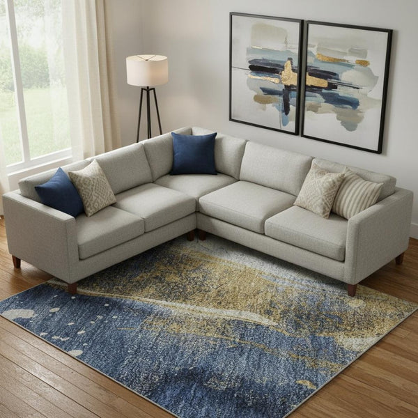 HomeRoots 9' X 12' Blue Gold Ivory Abstract Area Rug - Washable, UV Protected, Stain Resistant, Modern Design 694205