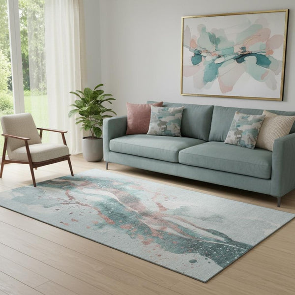 HomeRoots 5' X 8' Abstract Teal Salmon Ivory Washable Area Rug - Durable, UV-Protected, Stain-Resistant Comfort 694220