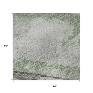 HomeRoots 5' X 8' Artichoke Green Striped Washable Area Rug - Durable, UV Protected & Stain Resistant Design 694268