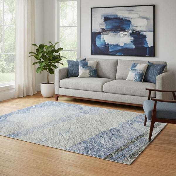 HomeRoots 5' X 8' Striped Sky Blue, Gray & Silver Washable Area Rug with UV Protection for Stylish Living Spaces 694292