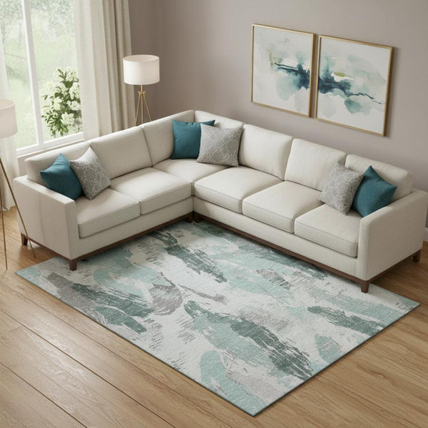 HomeRoots 9' X 12' Teal Ivory and Gray Abstract Area Rug - Washable, UV Protected, Durable for High-Traffic Spaces 694669