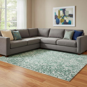 HomeRoots 8' X 10' Teal Peach Ivory Abstract Area Rug - Stylish Washable, UV Protected, Family Friendly Decor 695724