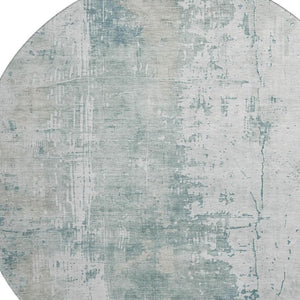 HomeRoots 8' Turquoise and Ivory Abstract Washable Round Rug - UV Protected, Stylish, Easy-Clean Design for All Spaces 696041