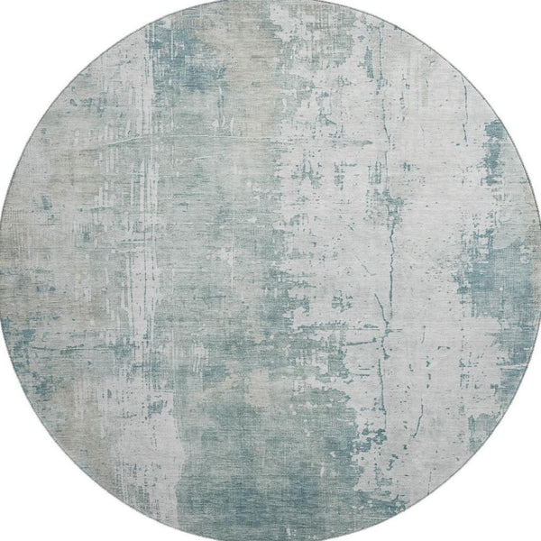 HomeRoots 8' Turquoise and Ivory Abstract Washable Round Rug - UV Protected, Stylish, Easy-Clean Design for All Spaces 696041