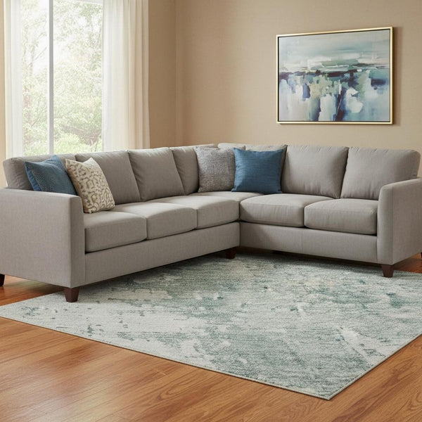 HomeRoots 8' X 10' Turquoise and Ivory Abstract Area Rug - Washable, UV-Protected, Durable for High Traffic Spaces 696042