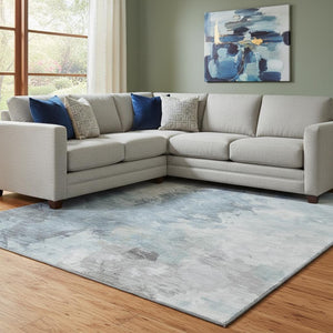 HomeRoots 8' X 10' Sky Blue Gray Silver Abstract Washable Area Rug - Durable, UV-Protected, and Stain-Resistant! 696792